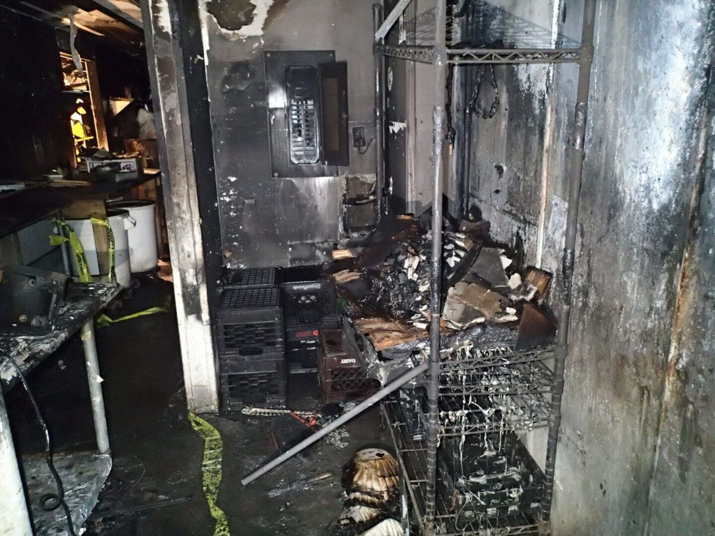 A room that has been burned and is in the middle of fire.