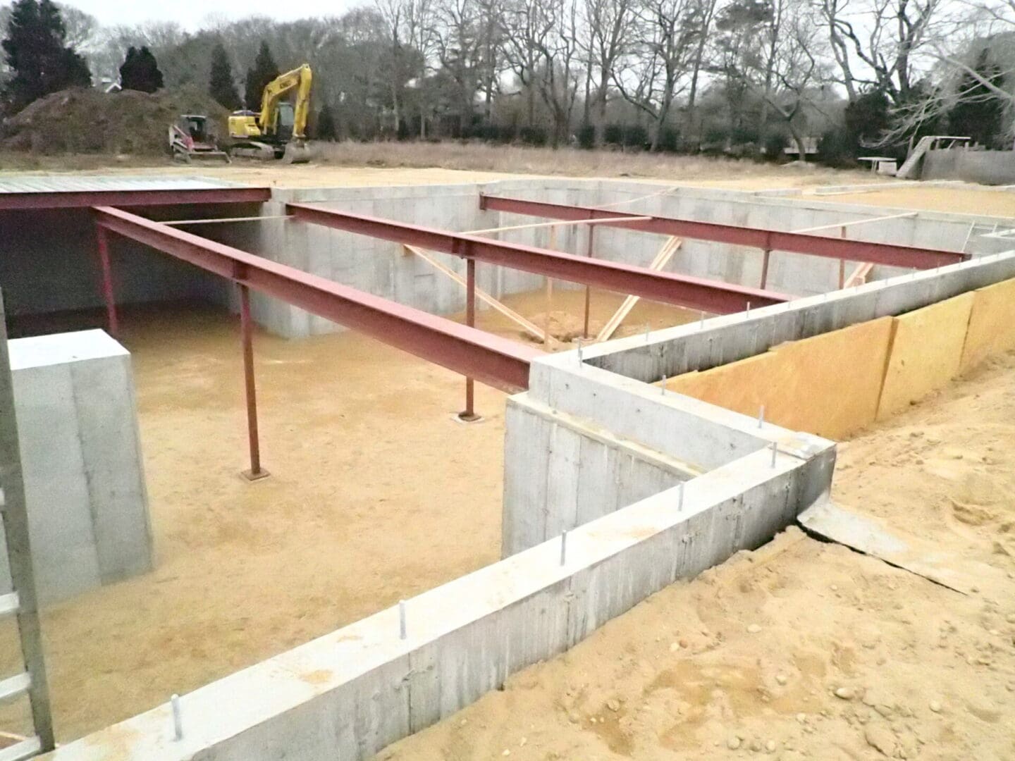 A concrete slab with metal beams and a steel beam.