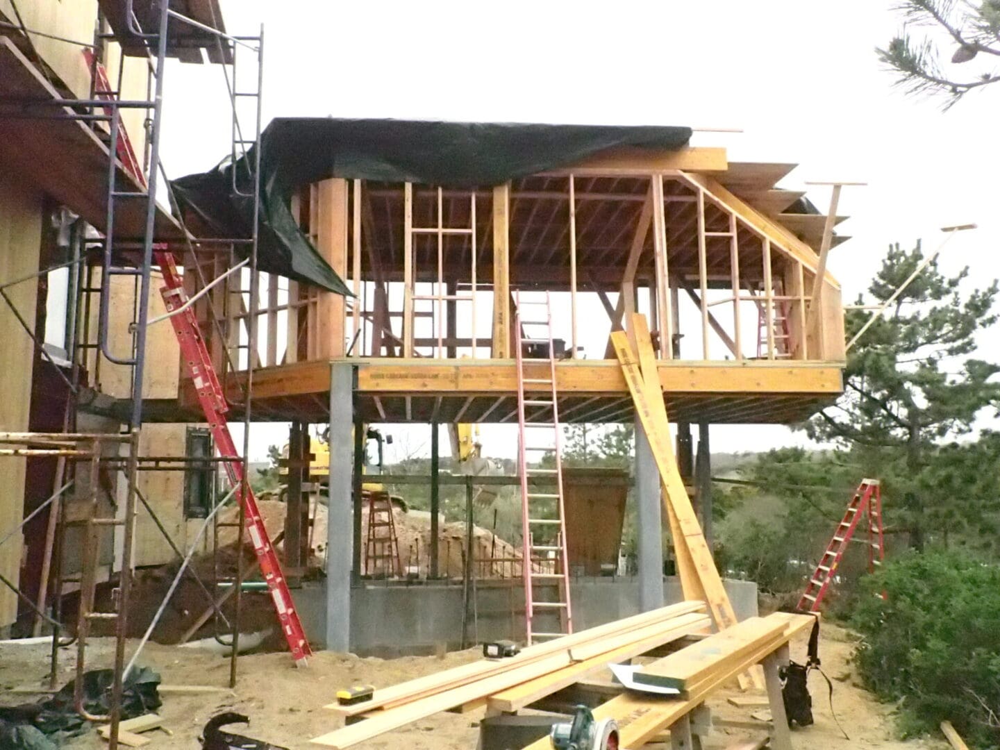 A building being built with scaffolding and wooden beams.